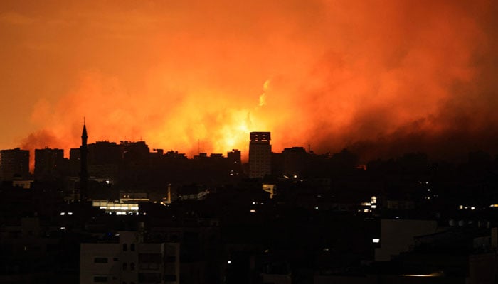 A ball of fire erupts in Gaza City after an Israeli air strike on October 12, 2023. AFP/File
