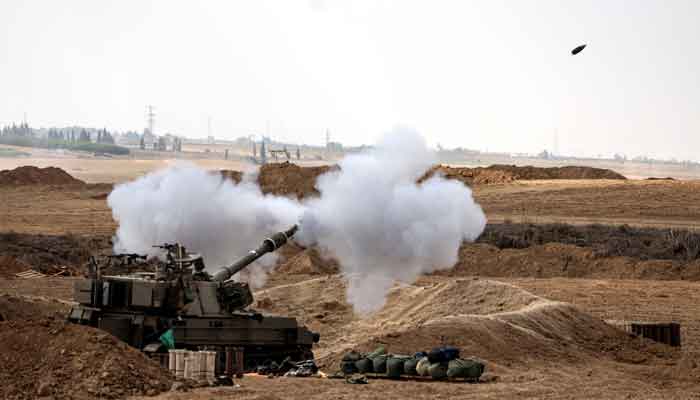 An Israeli tank fires near Israels border with the Gaza Strip, in southern Israel, October 12, 2023. —Reuters
