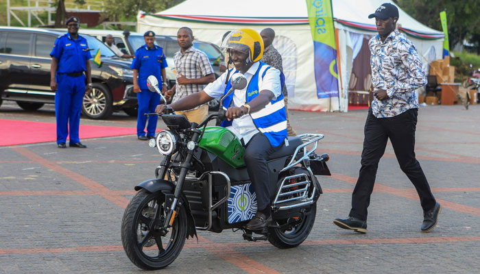 Kenyas President William Ruto rides an electric motorcycle during the national launch of an electric motorcycle project dubbed e-bodaboda at the Kenyan Coastal city of Mombasa on September 1, 2023. — AFP