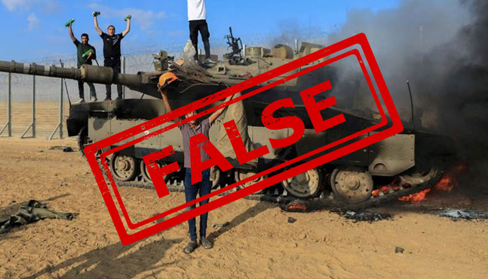 Palestinians celebrate as an Israeli military vehicle burns after it was hit by Palestinian gunmen who infiltrated areas of southern Israel, at the Israeli side of the Israel-Gaza border, October 7, 2023. —Reuters