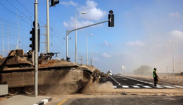 An Israeli tank takes up position near Israels border with the Gaza Strip, in southern Israel, October 13, 2023. — Reuters