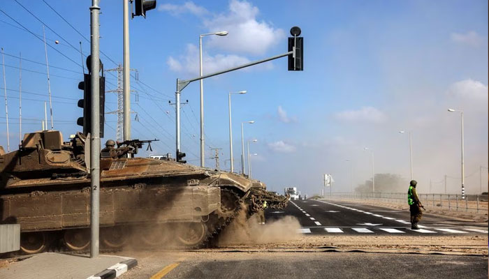 An Israeli tank takes up position near Israels border with the Gaza Strip, in southern Israel, October 13, 2023.— Reuters