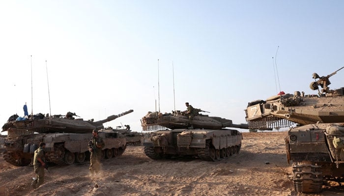 Israeli tanks are seen in the aftermath of a mass infiltration by Hamas gunmen from the Gaza Strip, in Kibbutz Beeri in southern Israel, October 14, 2023. — Reuters