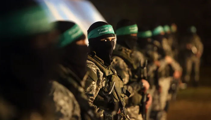 Palestinian members of the al-Qassam Brigades, the armed wing of the Hamas movement, take part in a gathering on January 31, 2016, in Gaza City to pay tribute to their fellow militants who died after a tunnel collapsed in the Gaza Strip. — AFP