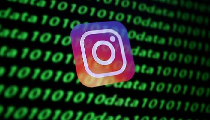 Image shows Instagram logo with algorithms in the background. — Unsplash