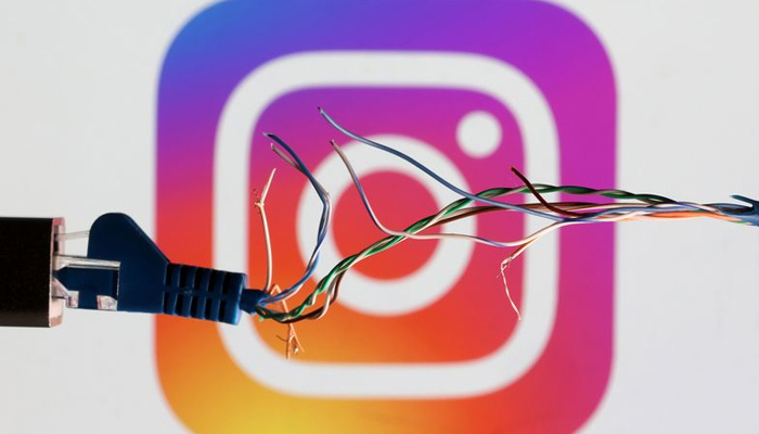 Image shows Instagrams logo with a broken wire in the foreground. — Reuters/File