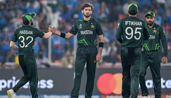 Shaheen Shah Afridi (C) celebrates with teammates after taking the wicket of Indias captain Rohit Sharma during the 2023 ICC Men´s Cricket World Cup one-day international (ODI) match between India and Pakistan at the Narendra Modi Stadium in Ahmedabad on October 14, 2023. —AFP