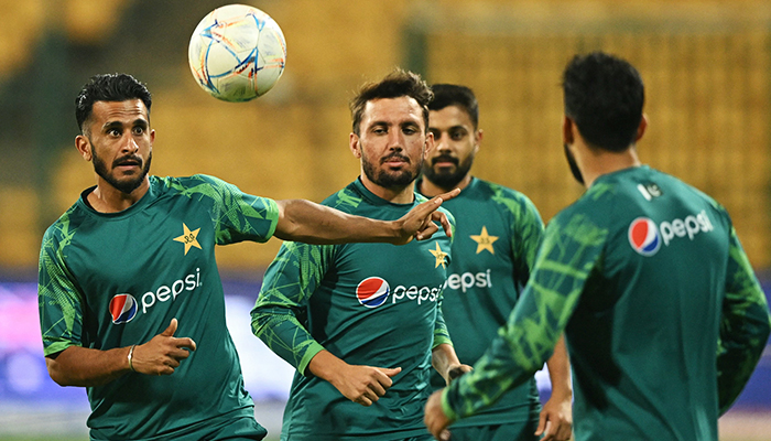 Pakistans Hasan Ali plays football during a practice session on the eve of the 2023 ICC Mens Cricket World Cup ODI match between Pakistan and Australia at the M Chinnaswamy Stadium in Bengaluru on October 19, 2023. — AFP