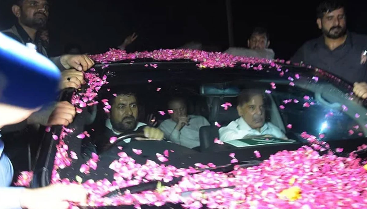 Former Pakistani prime minister Nawaz Sharif (centre-back) sits in a vehicle alongside his younger brother Shahbaz Sharif (right) following his release from Adiala prison in Rawalpindi on September 19, 2018. — AFP