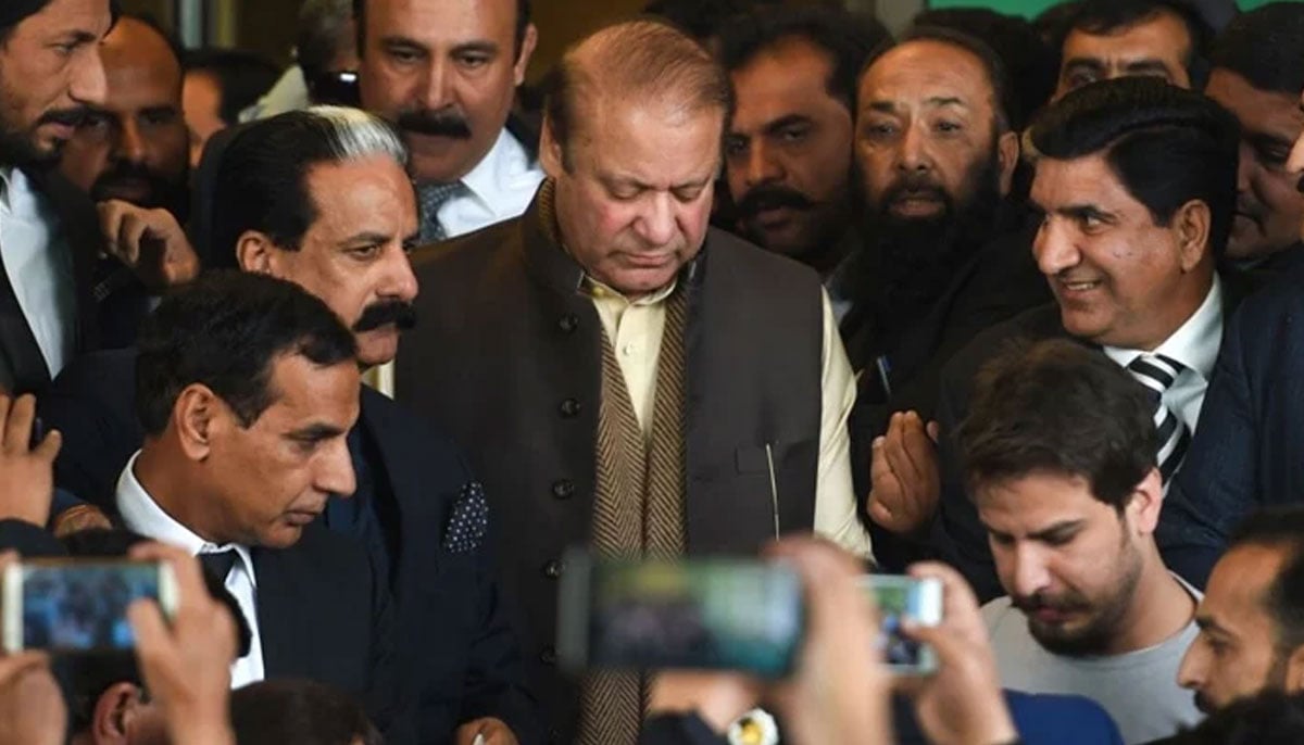 Former Pakistani Prime Minister Nawaz Sharif (C) leaves the Supreme Court building after the shrine land case hearing in Islamabad, December 4, 2018, days before conviction in Al-Azizia case. — AFP