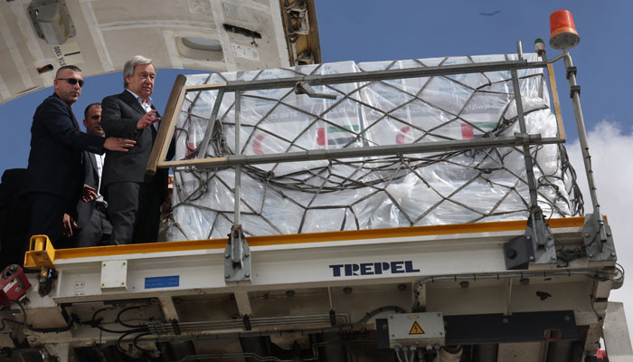United Nations Secretary-General Antonio Guterres inspects aid for Palestinians, as officials wait to deliver aid to Gaza through the Rafah border crossing between Egypt and the Gaza Strip, amid the ongoing conflict between Israel and Hamas, at Al Arish airport, in Egypt, October 20, 2023. — Reuters