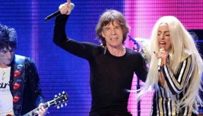 Lady Gaga and Mick Jagger mimic each others dance moves