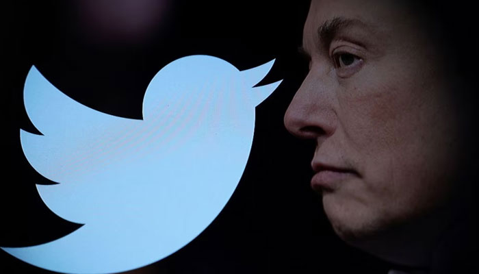Twitter logo and a photo of Elon Musk are displayed through a magnifier in this illustration taken October 27, 2022.—Reuters