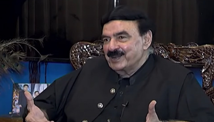 AML chief Sheikh Rashid Ahmed speaks to TV host during an interview with private channel in this still taken from a video. — YouTube