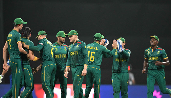 South Africa´s players celebrate after the dismissal of England´s captain Jos Buttler during the 2023 ICC Men´s Cricket World Cup between England and South Africa at the Wankhede Stadium in Mumbai on October 21, 2023. — AFP