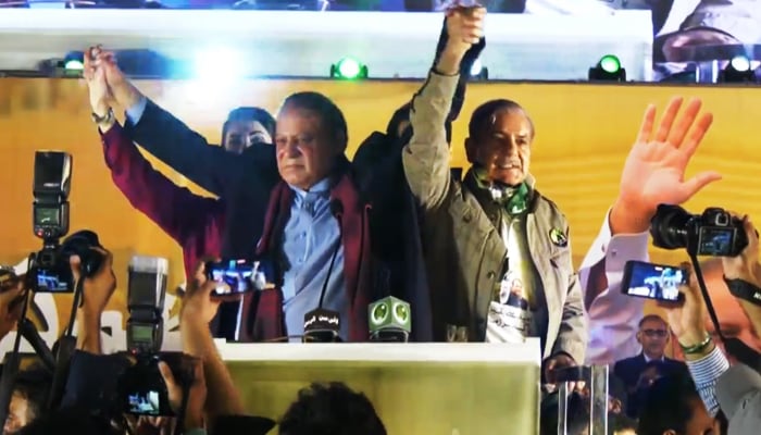 (L to R) PML-N leaders Maryam Nawaz, Nawaz Sharif, and Shehbaz Sharif at the stage during a rally at Minar-e-Pakistan in Lahore, on October 21, 2023, in this still taken from a video. — X@pmln_org