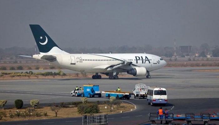 A Pakistan International Airlines (PIA) plane prepares to take off at Alama Iqbal International Airport in Lahore on February 1, 2012. — Reuters