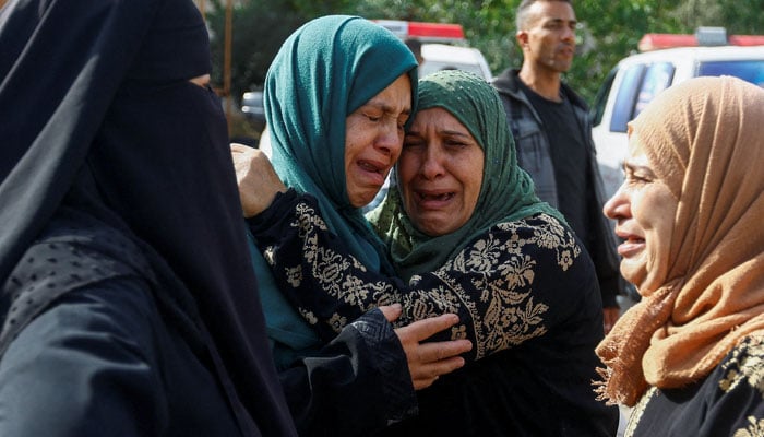 Mourners attend the funeral of Palestinians from the al-Astal family, who were killed in Israeli strikes, in Khan Younis, in the southern Gaza Strip October 22, 2023. — Reuters