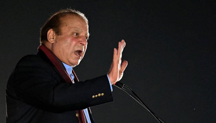PML-N supremo Nawaz Sharif addresses his supporters gathered at a Minar-e-Pakistan during an event held to welcome him in Lahore on October 21, 2023. — AFP