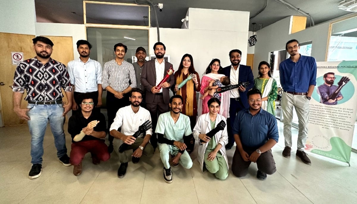 A group photo of Bioniks staff along with Anas Niaz and Ovais H. Qureshi, mechatronic engineers and co-founders of Bioniks, showcasing their innovation - Artificial Intelligence-driven prosthetic arms on October 5, 2023. — Photo by author