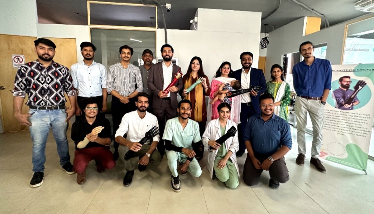 A group photo of Bioniks staff along with Anas Niaz and Ovais H. Qureshi, mechatronic engineers and co-founders of Bioniks, showcasing their innovation - Artificial Intelligence-driven prosthetic arms on October 5, 2023. — Photo by author