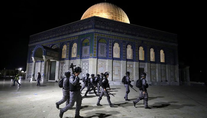 Israeli police walk near the Dome of the Rock during clashes with Palestinians at a compound known to Muslims as the Noble Sanctuary and to Jews as Temple Mount, amid tension over the possible eviction of several Palestinian families from homes on land claimed by Jewish settlers in the Sheikh Jarrah neighbourhood, in Jerusalems Old City, May 7, 2021.—Reuters