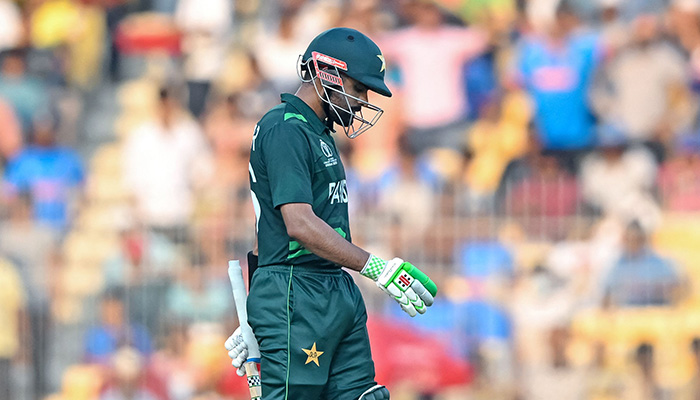 Pakistans captain Babar Azam walks back to the pavilion after his dismissal during the 2023 ICC Men´s Cricket World Cup one-day international (ODI) match between Pakistan and Afghanistan at the MA Chidambaram Stadium in Chennai on October 23, 2023. — AFP
