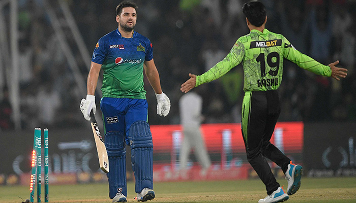 Lahore Qalandars Afghan legspinner Rashid Khan (right) celebrates after the dismissal of Multan Sultans´ South African batsman Rilee Rossouw (left) during the Pakistan Super League (PSL) Twenty20 cricket final match between Lahore Qalandars and Multan Sultans at the Gaddafi Cricket Stadium in Lahore on March 18, 2023. — AFP