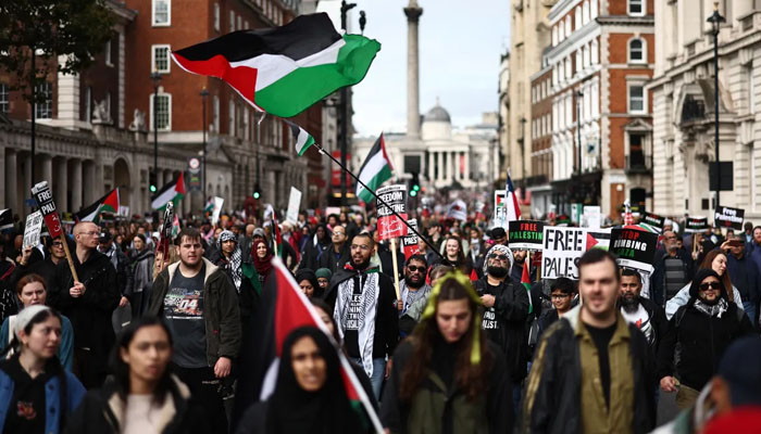 Demonstrators gather in the rain at Marble Arch near Londons Hyde Park before marching to the government district, Whitehall. — AFP