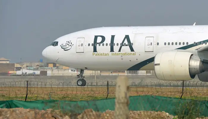 A PIA aircraft is parked at the airport in this file photo. — AFP