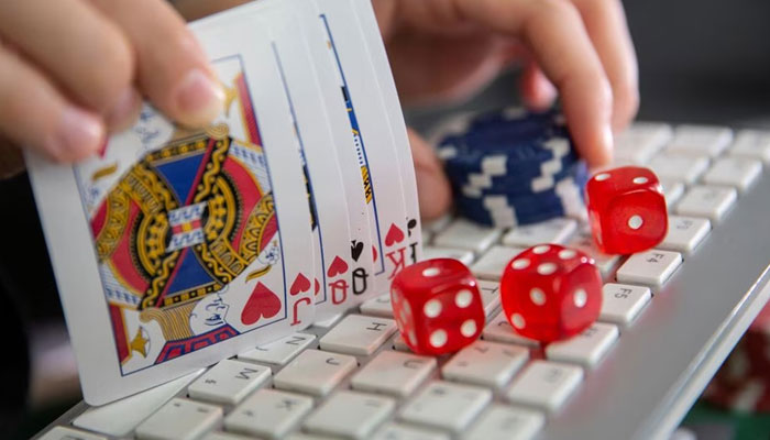 Keyboard, cards, chips, dice are seen in this illustration picture, June 5, 2020. — Reuters