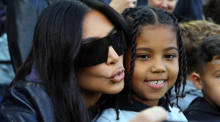 Kim Kardashian, Kanye West’s son Saint flips off the paparazzi again