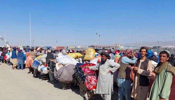 Afghan citizens wait with their belongings to cross into Afghanistan, after Pakistan gives the last warning to undocumented immigrants to leave, at the Friendship Gate of Chaman Border Crossing along the Pakistan-Afghanistan Border in Balochistan Province, in Chaman, Pakistan October 31, 2023. — Reuters