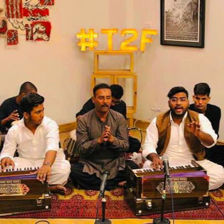 Ali Akbar Razi (centre) performs with his sons Fattah Ali (second from right) and Turab Ali (third from left) in Karachi. — Facebook/fattahaliTurabAliOfficial