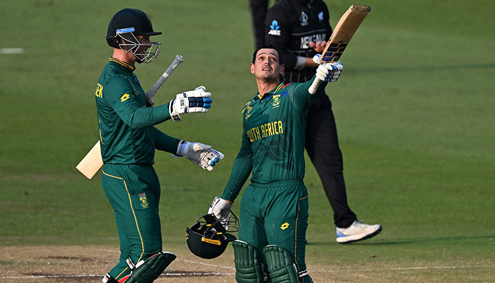 South Africas Quinton de Kock (R) celebrates with teammate Rassie van der Dussen after scoring a century (100 runs) during the 2023 ICC Men´s Cricket World Cup one-day international (ODI) match between New Zealand and South Africa at the Maharashtra Cricket Association Stadium in Pune on November 1, 2023. — AFP