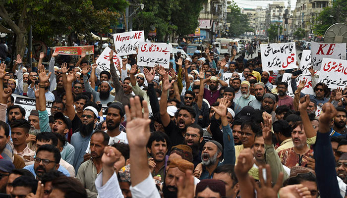 Traders shout slogans during a protest at a street in Karachi on August 23, 2023, against the surge in petrol and electricity prices as Pakistan endures soaring inflation. — AFP