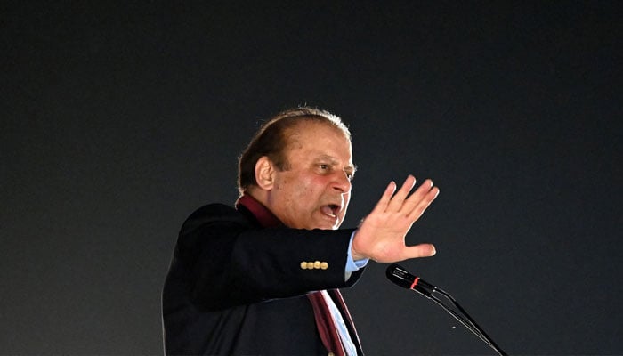 Pakistan´s former Prime Minister Nawaz Sharif addresses his supporters gathered at a park during an event held to welcome him in Lahore on October 21, 2023. — AFP