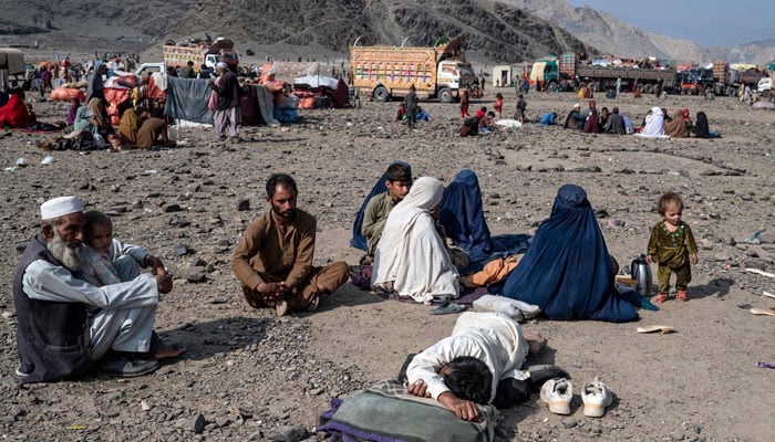 Afghan refugees rest upon their arrival from Pakistan at the Afghanistan-Pakistan Torkham border in Nangarhar province on November 2, 2023. — AFP