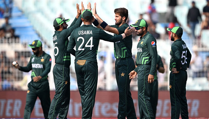 Pakistan´s Shaheen Shah Afridi (3R) celebrates with teammates after taking the wicket of Bangladesh´s Tanzid Hasan during the 2023 ICC Men´s Cricket World Cup one-day international (ODI) match between Pakistan and Bangladesh at the Eden Gardens in Kolkata on October 31, 2023. — AFP