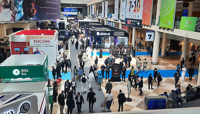 Gitex Global attendees seen at the Dubai World Trade Centre in Dubai, United Arab Emirates. — Photo by author