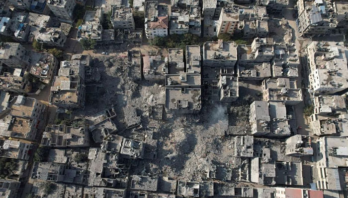 Palestinians gather at the site of Israeli strikes on houses in Bureij in the central Gaza Strip, November 2, 2023.—Reuters