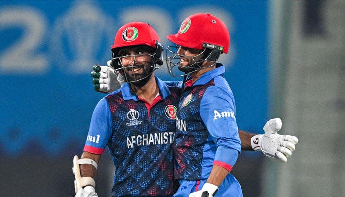 Afghanistan´s captain Hashmatullah Shahidi (left) celebrates after scoring a half-century with Azmatullah Omarzai during the World Cup match between Netherlands and Afghanistan at the Ekana Cricket Stadium in Lucknow on November 3, 2023. — AFP