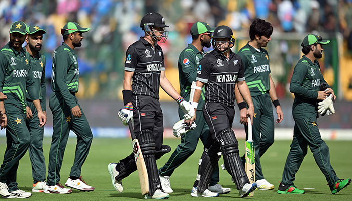 New Zealand and Pakistan players return back to the pavilion after the end of the first inning atM. Chinnaswamy Stadium, Bengaluru, India on November 4, 2023. — Reuters