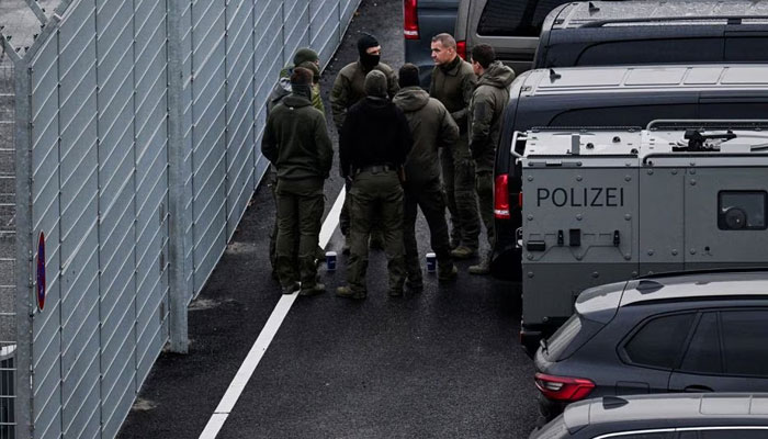 Police secure the area after a man drove through a barrier onto the grounds of the citys airport with a child in his car in Hamburg, Germany, November 5, 2023.—Reuters