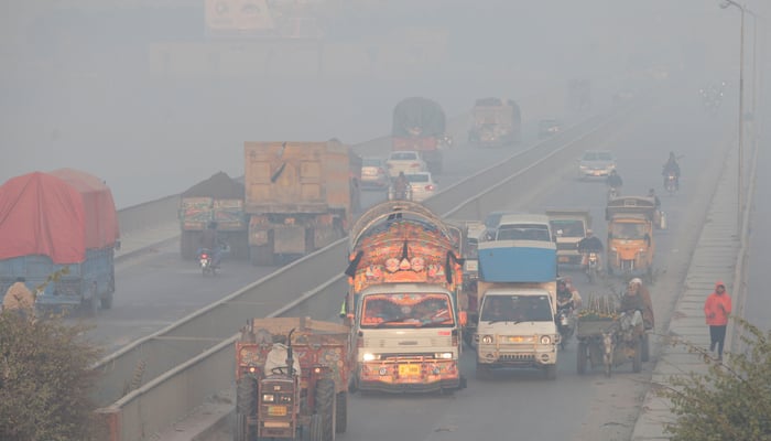 Vehicles move amid dense smog in Lahore, Pakistan November 24, 2021. — Reuters