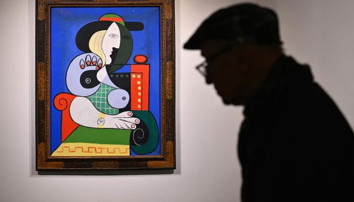 Pablo Picassos Femme á la montre is expected to fetch at least US$120 million (S$163 million). —AFP