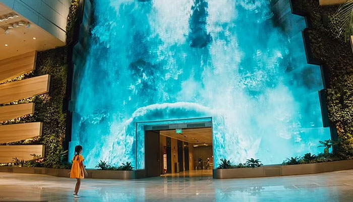 Singapores Changi Airport, known as the worlds best airport, refreshed and expanded its Terminal 2. Among the standout new features at the terminal is a 46ft- (14m) tall digital waterfall.—Changi Airport