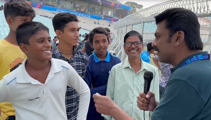 Fans at the Eden Garden talk about watching the Pakistan team practice in this still taken form a video. — Geo News