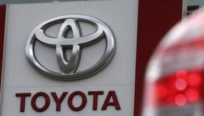 A sign with a logo is on display at a Toyota car sales and showroom in St. Petersburg, September 18, 2013. — Reuters