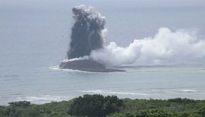 This picture shows the tiny new island, which is now a part of the Ogasawara Island chain, showing a small eruption that sent a dark cloud of ash above it. — CNN/Japan Maritime Self-Defense Force